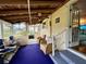 Relaxing screened porch with wicker furniture and ceiling fan at 3109 Sand Trap Ct, Lakeland, FL 33810