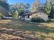 Spacious backyard with shed and mature trees at 2450 Ne 40Th St, Ocala, FL 34479