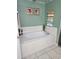 Bathroom with a garden tub, double sinks, and tile flooring at 619 Parakeet Ct, Kissimmee, FL 34759