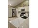 Modern kitchen with white cabinets, stainless steel appliances, and quartz countertops at 619 Parakeet Ct, Kissimmee, FL 34759