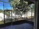 Cozy screened porch overlooking the backyard at 619 Parakeet Ct, Kissimmee, FL 34759