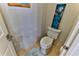 Small half bathroom with toilet and decorative art at 706 Lake Diamond Ave, Ocala, FL 34472