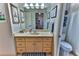 Clean bathroom with a single sink vanity and toilet at 706 Lake Diamond Ave, Ocala, FL 34472