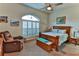 Relaxing bedroom with comfortable seating and large windows at 706 Lake Diamond Ave, Ocala, FL 34472