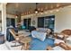 Relaxing covered patio furnished with wicker furniture at 706 Lake Diamond Ave, Ocala, FL 34472