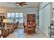 Formal dining area with wood table and chairs near living room at 706 Lake Diamond Ave, Ocala, FL 34472