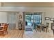 Bright dining area with wooden table and chairs, view to backyard pool at 706 Lake Diamond Ave, Ocala, FL 34472