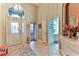 Bright and spacious entryway with tile flooring and high ceilings at 706 Lake Diamond Ave, Ocala, FL 34472