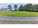 Scenic view of a lush green golf course with mature trees at 706 Lake Diamond Ave, Ocala, FL 34472