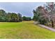 Landscaped golf course with trees and a cart path at 706 Lake Diamond Ave, Ocala, FL 34472