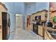 Kitchen with light wood cabinets, granite counters, and black appliances at 706 Lake Diamond Ave, Ocala, FL 34472