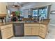 Kitchen island with sink and dishwasher, view to backyard at 706 Lake Diamond Ave, Ocala, FL 34472