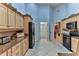 Kitchen with light wood cabinets, granite counters, and black appliances at 706 Lake Diamond Ave, Ocala, FL 34472