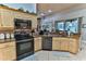 Kitchen features stainless steel appliances and granite countertops at 706 Lake Diamond Ave, Ocala, FL 34472