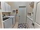 Laundry room with washer, dryer, and additional cabinets at 706 Lake Diamond Ave, Ocala, FL 34472