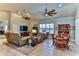 Spacious living room with comfortable seating and large TV at 706 Lake Diamond Ave, Ocala, FL 34472