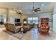 Spacious living room with comfortable seating and large TV at 706 Lake Diamond Ave, Ocala, FL 34472