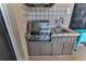 Outdoor kitchen with stainless steel grill and sink at 706 Lake Diamond Ave, Ocala, FL 34472