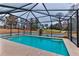 Refreshing screened pool with tranquil backyard views at 706 Lake Diamond Ave, Ocala, FL 34472