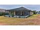 Screened-in pool and lanai with backyard access at 706 Lake Diamond Ave, Ocala, FL 34472