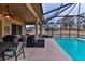 Relaxing poolside patio with seating and grilling area at 706 Lake Diamond Ave, Ocala, FL 34472