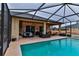 Inviting pool and patio area with covered lanai and seating at 706 Lake Diamond Ave, Ocala, FL 34472