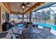 Spacious covered patio overlooking the pool at 706 Lake Diamond Ave, Ocala, FL 34472