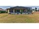 Spacious screened patio with seating area, perfect for outdoor relaxation at 706 Lake Diamond Ave, Ocala, FL 34472