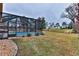 Relaxing screened pool area with a view of the golf course at 706 Lake Diamond Ave, Ocala, FL 34472