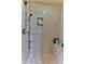 Walk-in shower with built-in seat and tiled walls at 706 Lake Diamond Ave, Ocala, FL 34472