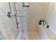 Large walk-in shower with built-in seat and tiled walls at 706 Lake Diamond Ave, Ocala, FL 34472
