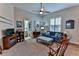 Comfortable sitting area featuring a sofa, ottoman, and fireplace at 706 Lake Diamond Ave, Ocala, FL 34472