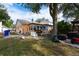 Backyard with deck, storage shed, and large tree at 1100 Lowry Ave # 7, Lakeland, FL 33801