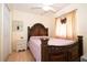 Cozy bedroom with a queen-size bed and ornate headboard at 1100 Lowry Ave # 7, Lakeland, FL 33801