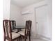 Small dining area with glass-top table and four chairs at 1100 Lowry Ave # 7, Lakeland, FL 33801