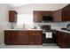Modern kitchen with stainless steel appliances and ample cabinetry at 1100 Lowry Ave # 7, Lakeland, FL 33801