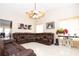 Spacious living room with sectional sofa and large TV at 1100 Lowry Ave # 7, Lakeland, FL 33801