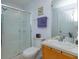 Clean bathroom with shower/tub combo, vanity, and wood cabinet at 2254 Wyndham Palms Way, Kissimmee, FL 34747