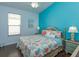 Bright bedroom with a king-size bed and coastal-themed decor at 2254 Wyndham Palms Way, Kissimmee, FL 34747