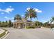 Gated community entrance with guardhouse and landscaping at 2254 Wyndham Palms Way, Kissimmee, FL 34747