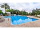 Resort-style pool with lounge chairs and umbrellas at 2254 Wyndham Palms Way, Kissimmee, FL 34747