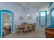 Dining room with light wooden table and six chairs, teal walls at 2254 Wyndham Palms Way, Kissimmee, FL 34747