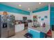 Bright kitchen with white cabinets, granite counters, and stainless steel appliances at 2254 Wyndham Palms Way, Kissimmee, FL 34747
