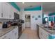 Modern kitchen featuring white cabinets, granite countertops, and a breakfast bar at 2254 Wyndham Palms Way, Kissimmee, FL 34747