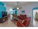 Living room with brown leather reclining furniture, teal walls at 2254 Wyndham Palms Way, Kissimmee, FL 34747