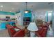 Open concept living room and kitchen with leather couches at 2254 Wyndham Palms Way, Kissimmee, FL 34747