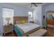 Relaxing Primary suite offering a king-size bed and ensuite bathroom access at 2254 Wyndham Palms Way, Kissimmee, FL 34747