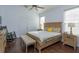 Spacious Primary bedroom with wood flooring and a ceiling fan at 2254 Wyndham Palms Way, Kissimmee, FL 34747