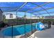 Refreshing screened pool and spa with safety fence at 2254 Wyndham Palms Way, Kissimmee, FL 34747