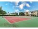 Two tennis courts with green fencing at 2254 Wyndham Palms Way, Kissimmee, FL 34747